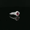18kt White Gold Oval Ruby & Diamond Halo Ring