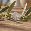 18kt White Gold Fancy Yellow Pear Shape Diamond Halo Ring