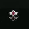 18kt White Gold Oval Ruby & Diamond Halo Ring
